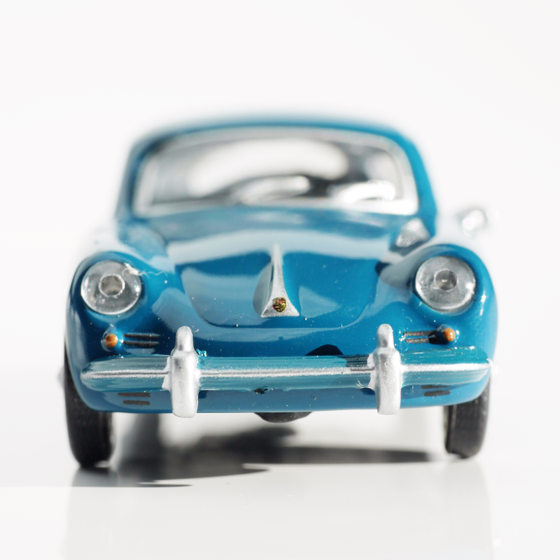 Illustration for article titled Kyosho Porsche 1 1/64 #84 - Projekt RennSport Käfer #2 - 1965 Porsche 356 C Coupe